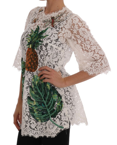 White lace blouse with crystal embellishments by Dolce & Gabbana, featuring intricate lace details and sparkling crystal accents.
