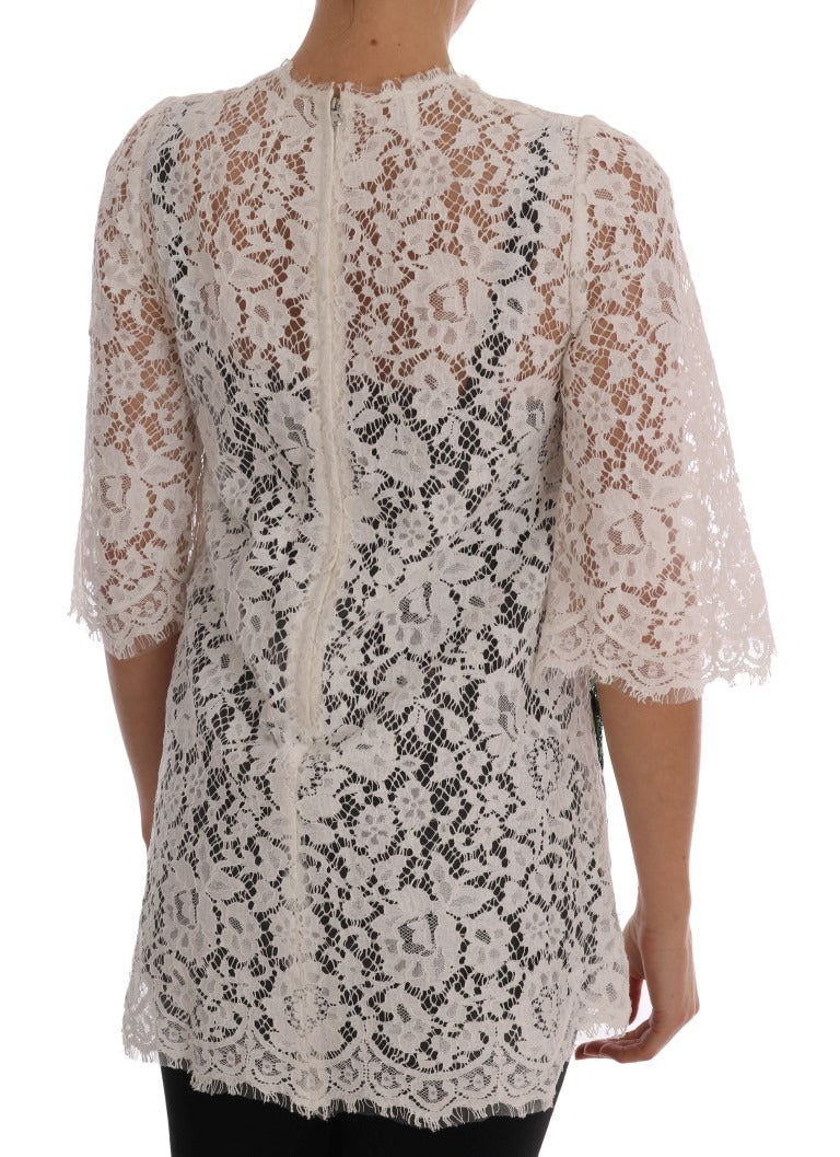 White lace blouse with crystal embellishments by Dolce & Gabbana, featuring intricate lace details and sparkling crystal accents.
