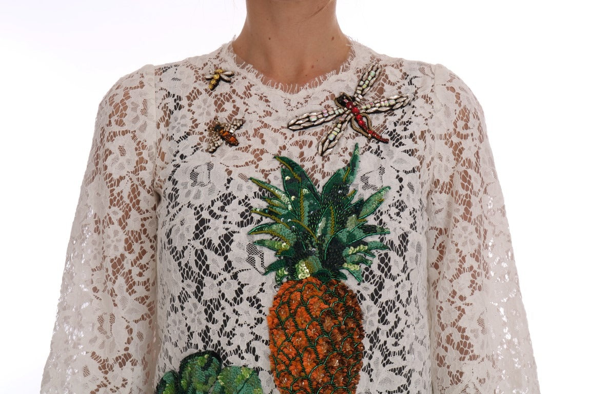White crystal-embellished lace blouse by Dolce & Gabbana, featuring intricate lace details and elegant embellishments.