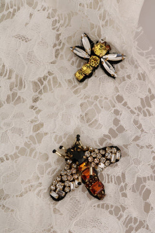 White crystal-embellished lace blouse by Dolce & Gabbana, featuring intricate lace details and elegant embellishments.