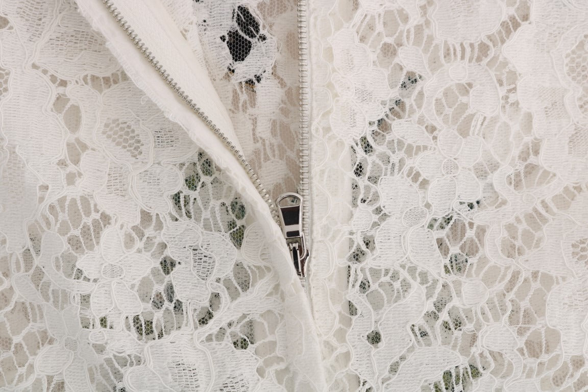 White lace blouse with crystal embellishments by Dolce & Gabbana, featuring intricate lace details and elegant design.