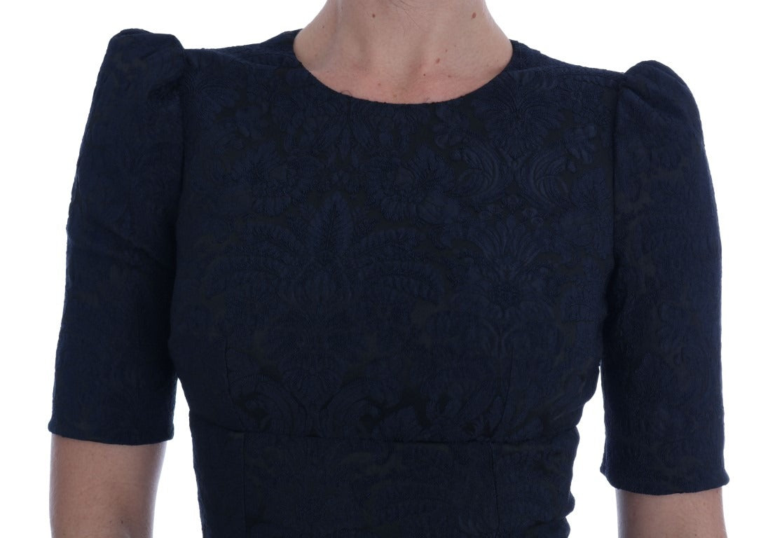 Black and blue flare mini dress by Dolce & Gabbana, featuring a fitted bodice and flared skirt, shown on a model.