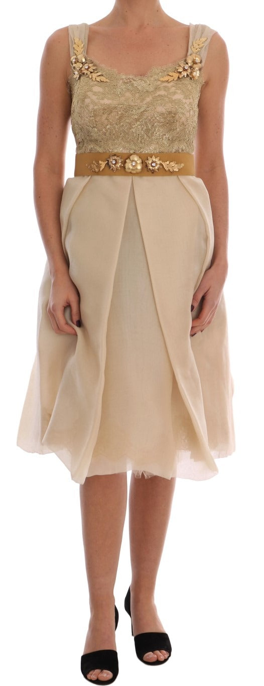 Gold silk dress with crystal embellishments by Dolce & Gabbana, featuring intricate detailing and elegant design.