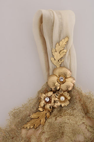 Gold silk dress with crystal embellishments by Dolce & Gabbana, featuring a flowing design and intricate detailing.