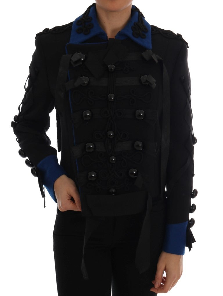 Black wool trench jacket by Dolce & Gabbana, tailored fit with classic collar and button details, displayed on a hanger.