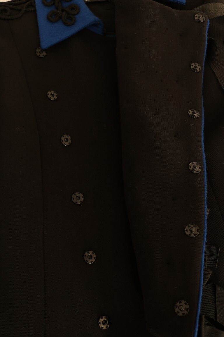 Black wool trench jacket by Dolce & Gabbana, shown on a hanger with a classic double-breasted design and belt details.