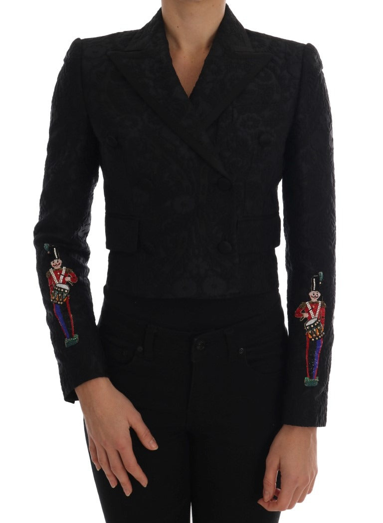 Black brocade blazer jacket by Dolce & Gabbana with intricate floral patterns and tailored fit, shown on a white background.