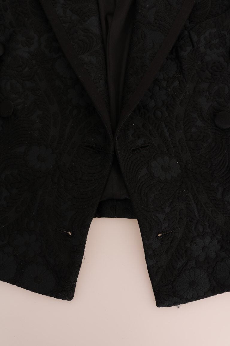 Black brocade blazer jacket by Dolce & Gabbana with intricate floral pattern and tailored fit, shown on a neutral background.