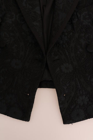 Black brocade blazer jacket by Dolce & Gabbana with intricate floral pattern and tailored fit, shown on a neutral background.