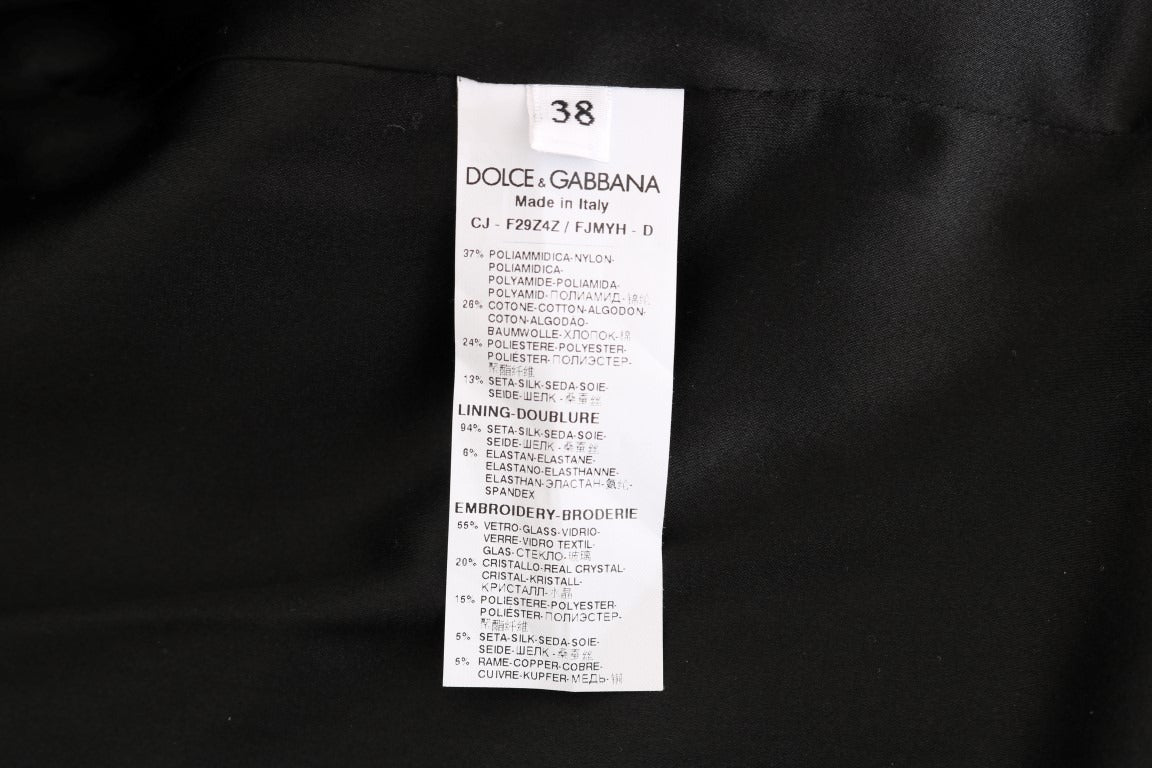Black brocade blazer jacket by Dolce & Gabbana, tailored fit with intricate floral pattern, front buttons, and classic lapel collar.