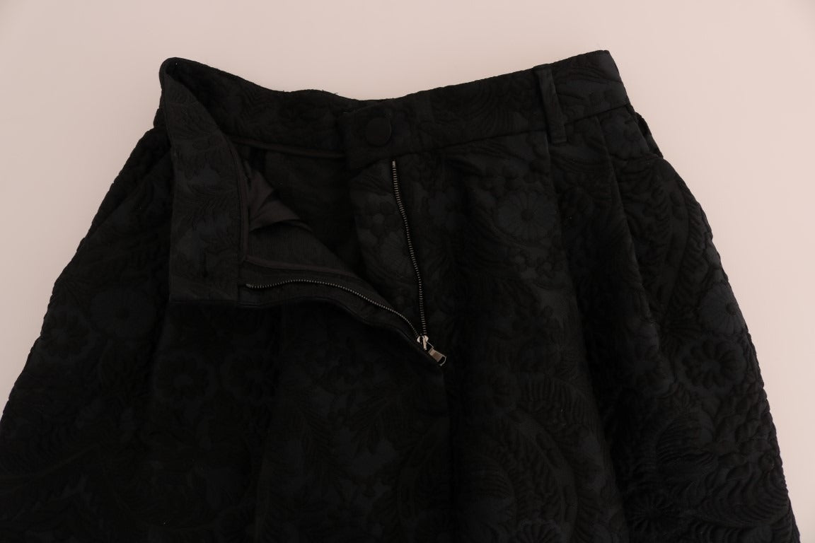 Black brocade high waist capri shorts by Dolce & Gabbana featuring intricate design and tailored fit.