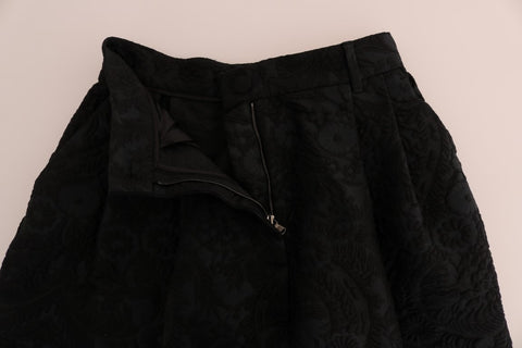 Black brocade high waist capri shorts by Dolce & Gabbana featuring intricate design and tailored fit.