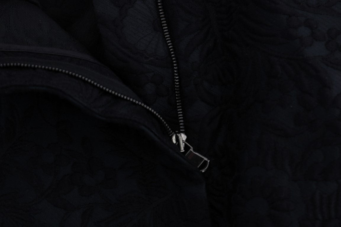 Black brocade high-waist capri shorts by Dolce & Gabbana, featuring intricate floral patterns and a tailored fit.