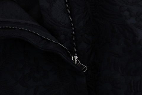 Black brocade high-waist capri shorts by Dolce & Gabbana, featuring intricate floral patterns and a tailored fit.