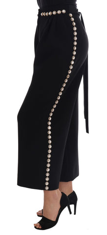 Black wool stretch crystal pants by Dolce & Gabbana, featuring fitted design and sparkling crystal embellishments.