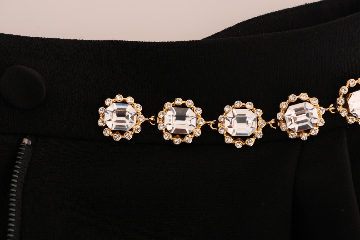 Black wool stretch crystal pants by Dolce & Gabbana, showing a close-up of the tailored fit and crystal embellishments.