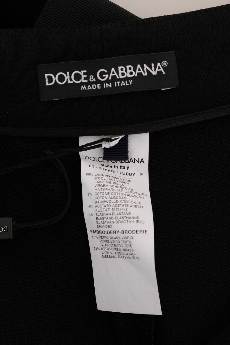 Black wool stretch crystal pants by Dolce & Gabbana, showing a close-up of the tailored fit with crystal embellishments.