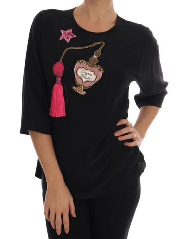 Black silk fairy tale top with crystal embellishments from Dolce & Gabbana, featuring a elegant, flowy design.