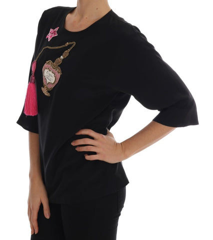 Black silk fairy tale top with crystal embellishments from Dolce & Gabbana, featuring a elegant, flowing design.