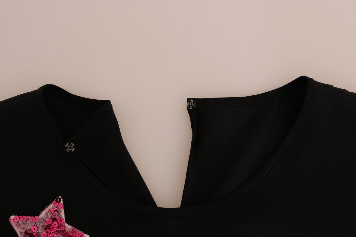 Black silk fairy tale top with crystal embellishments by Dolce & Gabbana, featuring a elegant, flowing design and intricate detailing.