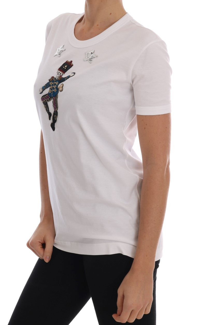 White cotton fairy tale T-shirt by Dolce & Gabbana with whimsical print, casual fit, and soft fabric visible in the image.