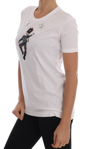 White cotton fairy tale T-shirt by Dolce & Gabbana with whimsical print, casual fit, and soft fabric visible in the image.
