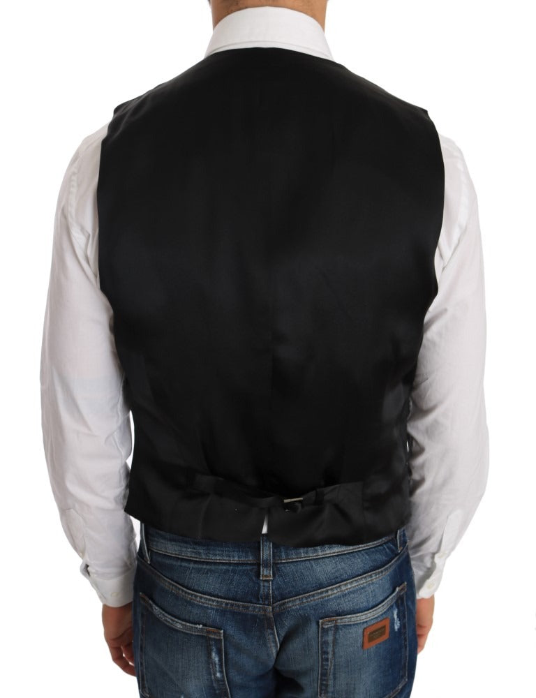 Black wool silk vest by Dolce & Gabbana, featuring a tailored fit and smooth fabric, shown on a hanger.
