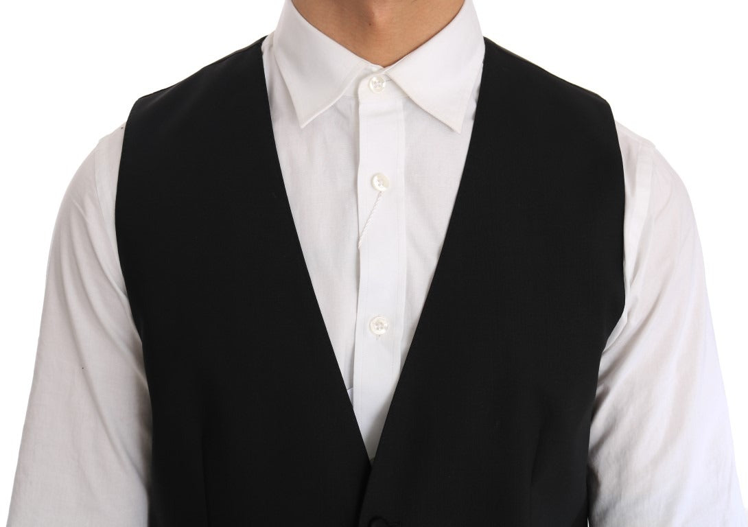 Black wool silk vest by Dolce & Gabbana, shown on a hanger, highlighting its smooth fabric and tailored fit.