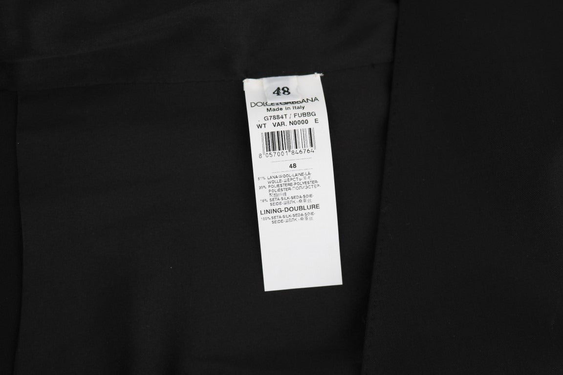 Black wool silk vest by Dolce & Gabbana, close-up showing textured fabric and tailored fit.