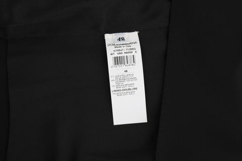 Black wool silk vest by Dolce & Gabbana, close-up showing textured fabric and tailored fit.
