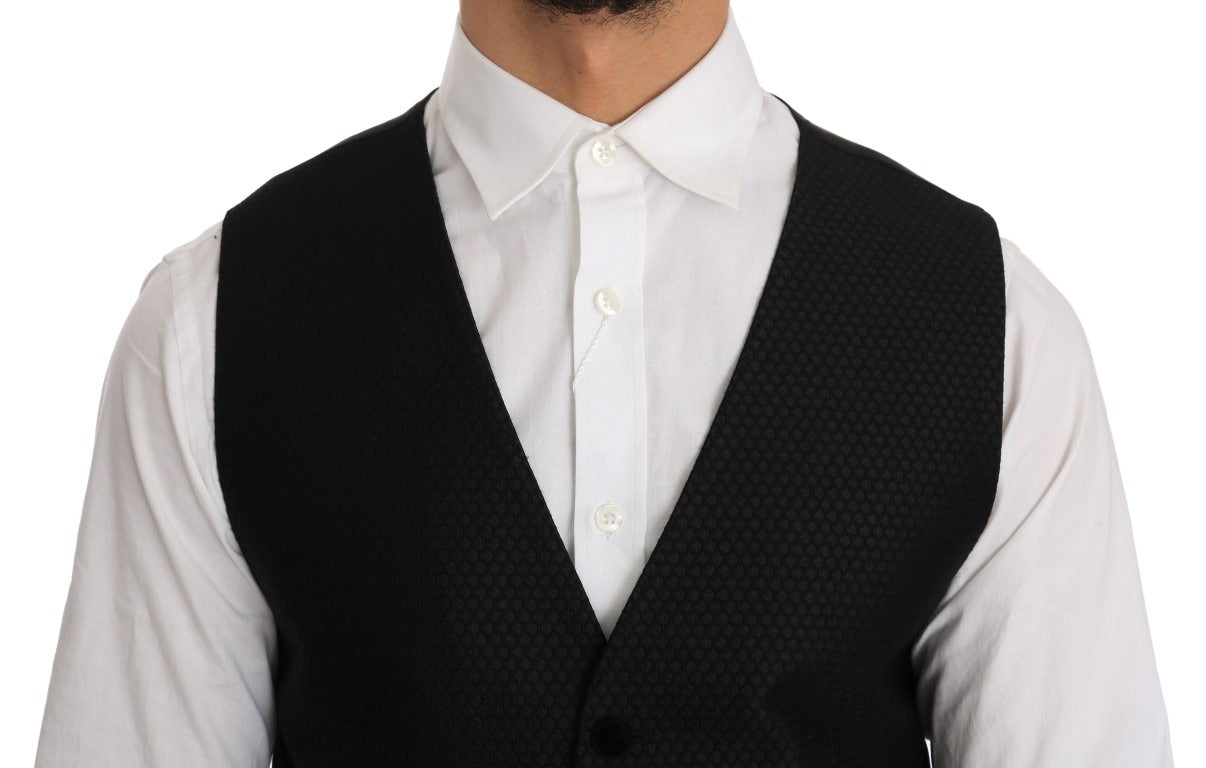Black polka dot pattern Dolce & Gabbana vest with sleeveless design and fitted silhouette, displayed on a plain background.