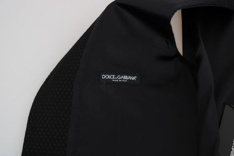 Black polka dot pattern vest by Dolce & Gabbana, featuring a stylish sleeveless design and classic dot print.