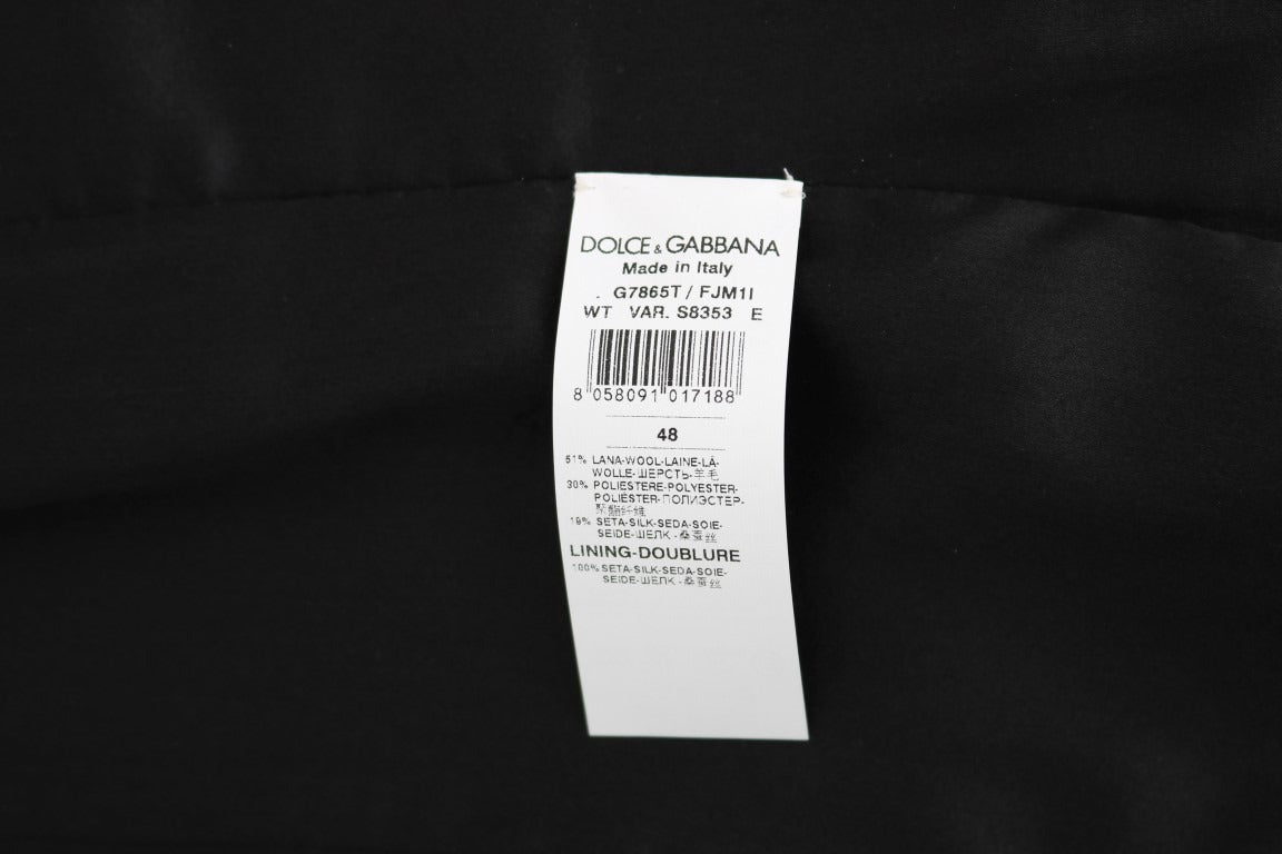 Black polka dot patterned vest by Dolce & Gabbana, featuring a stylish and fitted design with a V-neck and sleeveless cut.