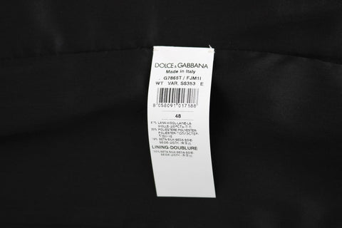 Black polka dot patterned vest by Dolce & Gabbana, featuring a stylish and fitted design with a V-neck and sleeveless cut.