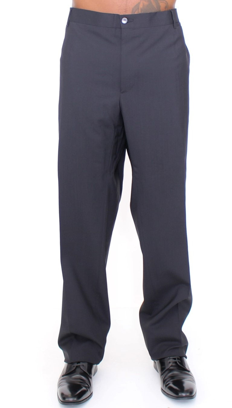 Black wool stretch pleated pants by Dolce & Gabbana, featuring tailored fit and elegant pleats, displayed on a neutral background.