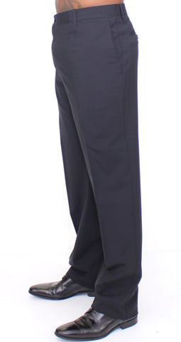 Black wool stretch pleated pants by Dolce & Gabbana, featuring a tailored fit and stylish pleats.
