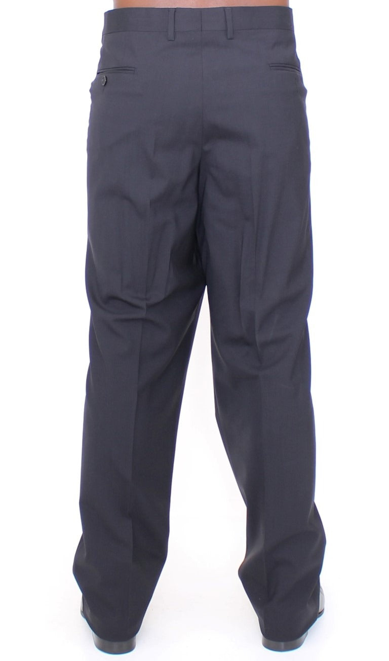 Black wool stretch pleated pants by Dolce & Gabbana, tailored with sharp pleats and a sleek fit.