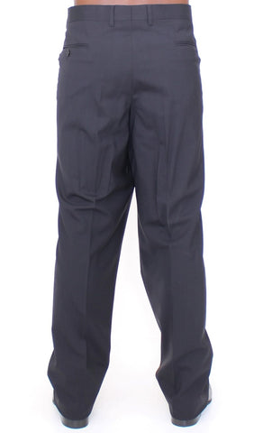 Black wool stretch pleated pants by Dolce & Gabbana, tailored with sharp pleats and a sleek fit.