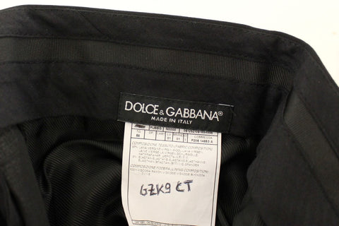 Black wool stretch pleated pants by Dolce & Gabbana, featuring tailored fit and elegant pleats, shown on a model.
