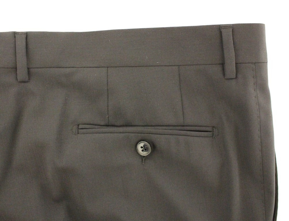 Black wool stretch pleated pants by Dolce & Gabbana, tailored fit with elegant pleats, showcased on a model.