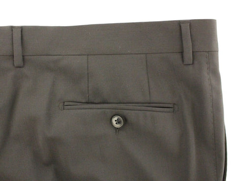 Black wool stretch pleated pants by Dolce & Gabbana, tailored fit with elegant pleats, showcased on a model.