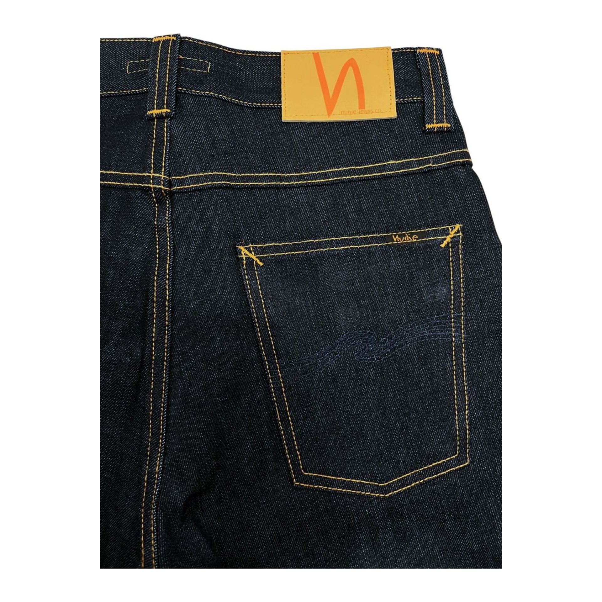 Nudie Jeans NJ1237 Regular Fit in navy blue denim, displayed on a hanger with visible stitching and classic five-pocket design.