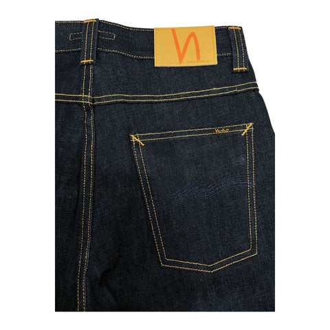 Nudie Jeans NJ1237 Regular Fit in navy blue denim, displayed on a hanger with visible stitching and classic five-pocket design.