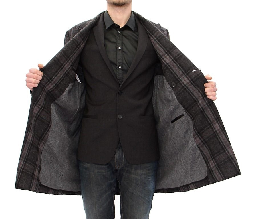 Gray double-breasted coat jacket by Dolce & Gabbana, featuring classic design and tailored fit, displayed on a hanger.