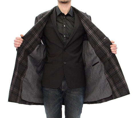 Gray double-breasted coat jacket by Dolce & Gabbana, featuring classic design and tailored fit, displayed on a hanger.