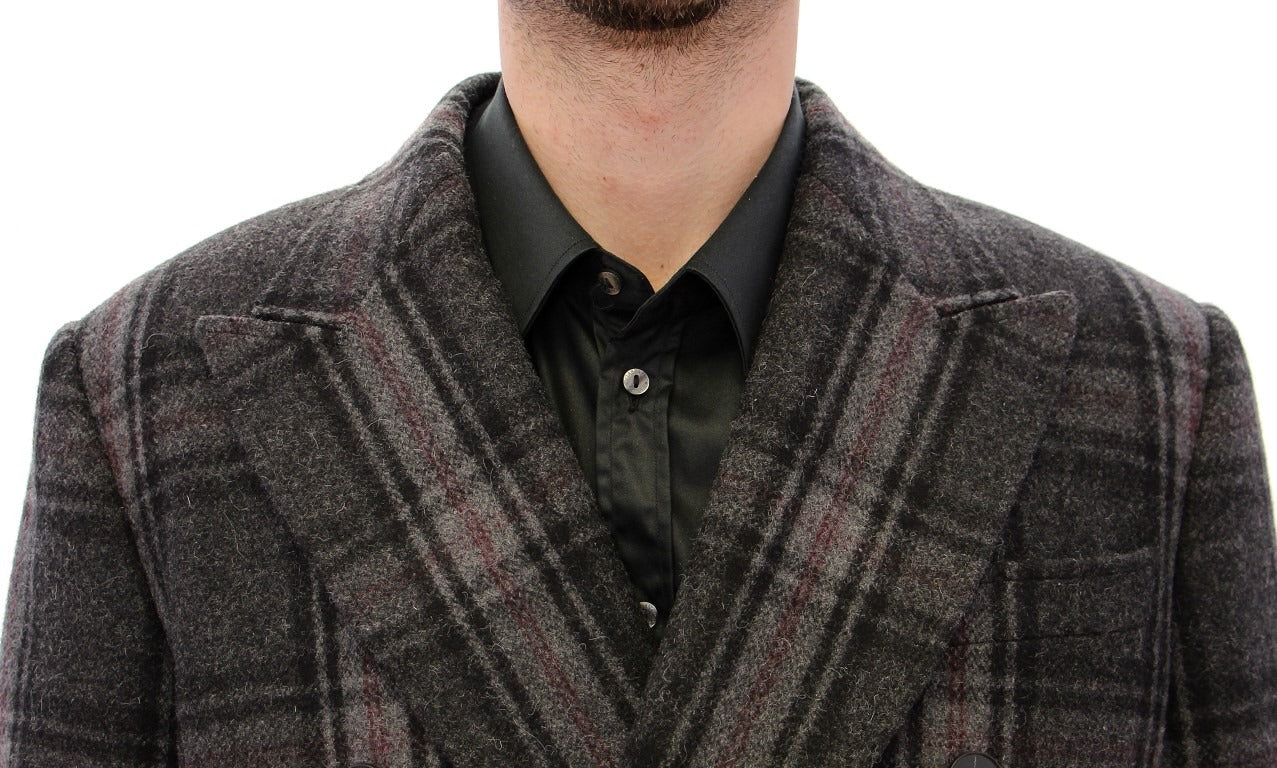 Gray double-breasted coat jacket by Dolce & Gabbana, shown on a hanger with detailed lapels and classic tailored fit.