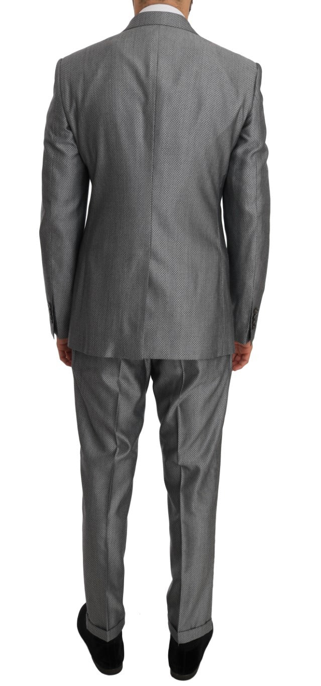 Black stretch crystal bee slim fit suit by Dolce & Gabbana, featuring tailored jacket and matching trousers with crystal bee details.