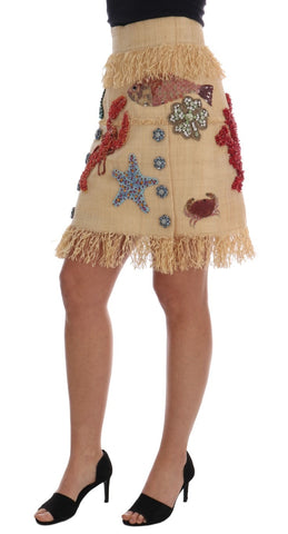 Crystal beige palm fiber skirt by Dolce & Gabbana, featuring a textured woven design and flowing silhouette.
