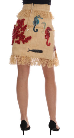 Crystal beige palm fiber skirt by Dolce & Gabbana featuring a flowy, textured design with intricate detailing.