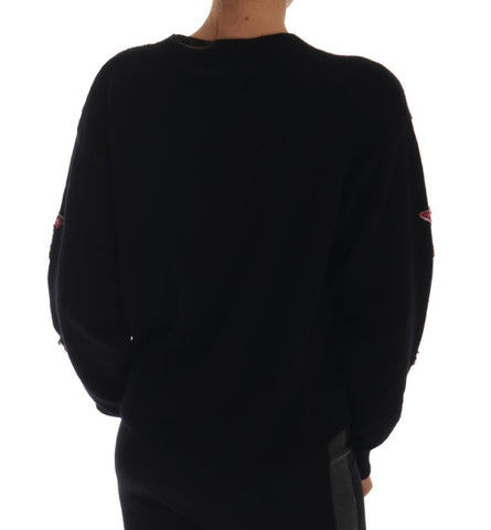 Black cashmere sweater with fairy tale crystal embellishments by Dolce & Gabbana, showcasing a cozy, luxurious knit design.